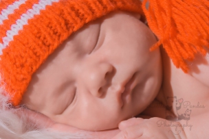 Newborn photography Hythe Folkestone Dymchurch Kent close up baby in red hat